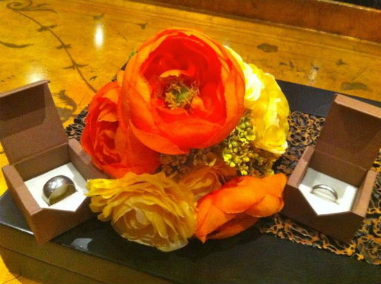 Aubin's ranunculus bouquet and wedding rings