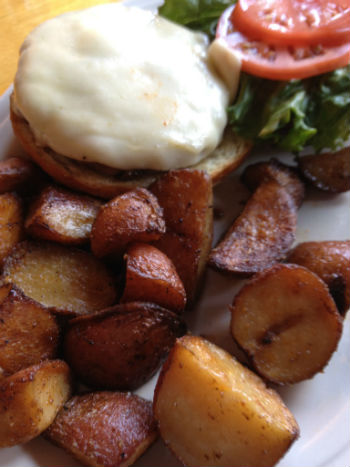 the fine provolone-topped burger and home fries that Alicia ordered
